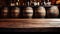 Old brown wood table in wine cellar on vintage barrels background, empty counter in restaurant, bar or cafe. Wooden casks in