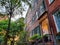 Old brownstone buildings along a quiet street in the West Village neighborhood of Manhattan in New York City