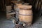 Old buckets and barrels in doorway of rustic barn