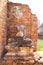 Old Buddha Statue and Orange Bricks at Chaiwatthanaram Temple