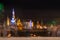 Old Buddhist architecture and people blurred at night