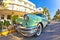 Old Buick from 1954 stands as attraction in front of famous Avalon Hotel in Miami Beach