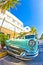 Old Buick from 1954 stands as attraction in front of famous Avalon Hotel in Miami Beach