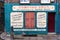 Old building with antique signage of a paper bag merchant in Shoreditch, London, UK