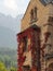 Old building facade with red vine