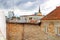 Old building in the foreground and morden buildings on the background in Tallinn, Estonia