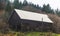 Old Building in Forested Fall Landscape