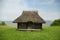 Old building with grass roof by the sea