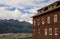 Old building with mountains.