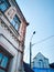 old building rooftop daylight windows streetlights city blue sky architecture