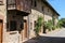 Old building with wooden balcony in medieval Grazzano Visconti,