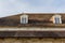 Old buildings with brick wall and tile roof, medieval style house