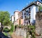 Old buildings on Carrera del Darro street in beautiful spring day, Granada, Spain