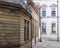 Old buildings on a cobbled street in rochdale town centre looking downhill on a sharp corner