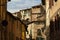 Old buildings inside one of the alleys of the town of Siena