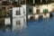 Old buildings reflecting in a river Abstract background .