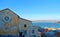 Old buildings and roofs with seascape in background in Portovenere  town. Lord Byron Park and Doria castle on Ligurian coast, La S