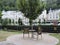 Old buildings, tree and two chairs in Karlovy Vary, Czech Republic