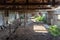 Old, built of wood and brick, abandoned broken barn