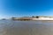 Old bunkers on the beaches at Skagen in north Denmark with the lighthouse in the background