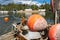 Old buoys loaded with anchors were pulled ashore to be replaced with new ones. The aged red buoys are faded from the water and are