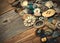 Old buttons in large numbers scattered on aged wooden boards