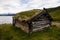 Old cabin in front of a lake in jotunheimen national park
