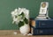 Old calendar and bird cherry branch in a jug