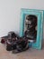 Old camera Fed with a bronze statue of Felix Edmundovich Dzerzhinsky in a wooden photo frame.