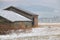 Old Canadian Farm Buildings in Valley in Winter