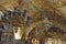 Old candle lamps and ceiling of the hall of the Golgotha altar in the Church of the Holy Sepulchre in Jerusalem