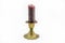 Old candlestick with a melted candle isolated on a white background