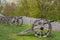 Old cannons with fortified stockade wooden defense wall