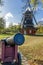 Old canon and windmill, framed by trees