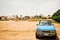 old car in desolate landscape