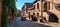 An old car is driving by Dolder gate tower in Riquewihr, Alsace, France