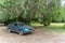 Old car on large farm