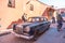 Old car and passerby bicycle on the Small street in Marrakech`s medina old town. In Marrakech the houses are