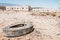 Old car tire dumped in desert landscape