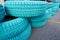 Old car tire painted with turquoise color