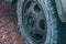 Old car wheel. Vintage car tires for offroad. Wheel of an old truck close-up.