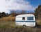 Old caravan abandoned in the countryside