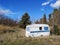 Old caravan abandoned in the countryside