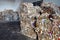 Old cardboard polyethylene and plastic pressed into bales at finished products warehouse on modern waste sorting and processing