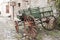 Old carriage parked in a cobbled colonial street, in Colonia, Uruguay