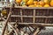 Old carriage with rusty wheels and pumpkins