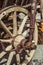 Old carriage with rusty wheels and pumpkins