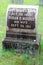 Old carved headstone set among other headstones and green grass, Greenridge Cemetery,Saratoga Springs, New York, 2018