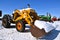 Old Case tractor with a bucket of fresh snow