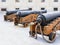 Old cast-iron artillery guns stand in a row, rear view perspective